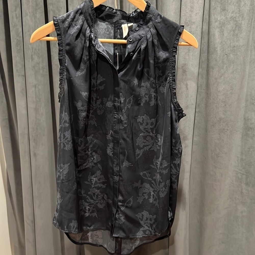 Sleeveless button down top with ruffles